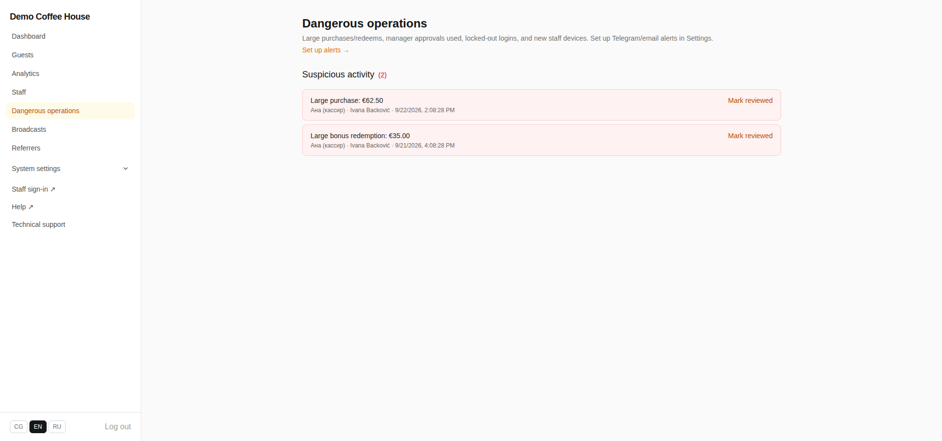 Dangerous operations page listing two flagged events, a large purchase and a large bonus redemption, each with cashier, guest, amount, date, and a Mark reviewed action, plus a Set up alerts link